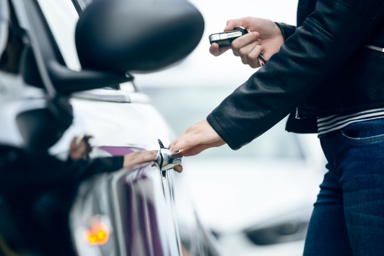 Passenger unlocking a car