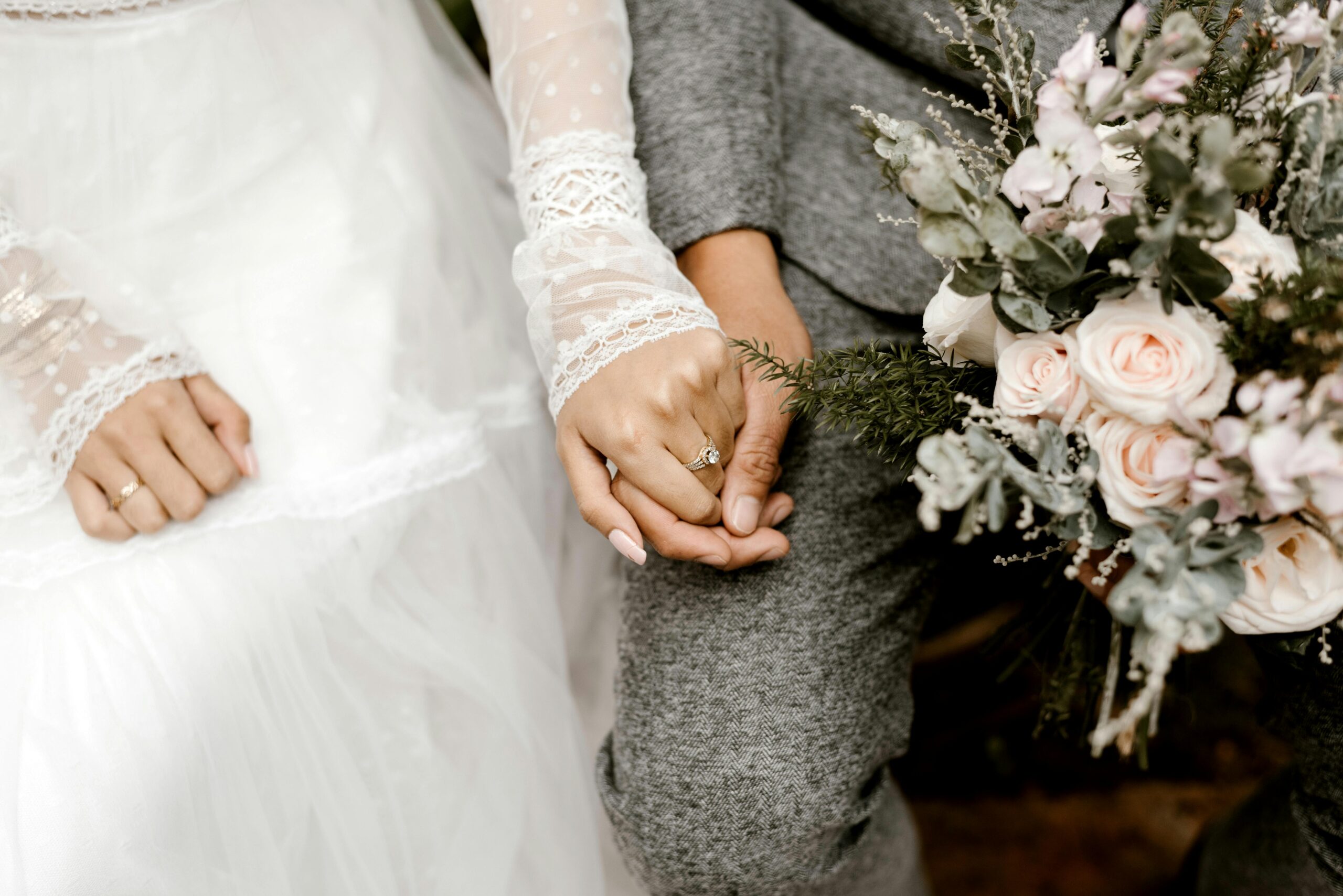 Wedding couple holding hands